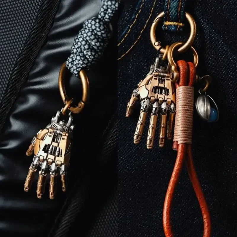 5cm mechanical bionic hand pendant with movable fingers, featured as a stylish charm on a bag.