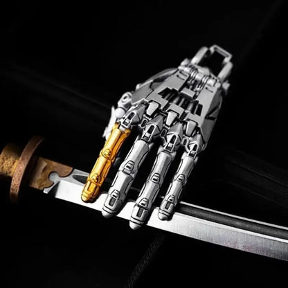 Collectible 5cm bionic robot hand pendant with movable joints, displayed on a sword, perfect for gifts.